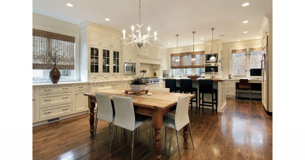 brown woven shades in a white beach home kitchen